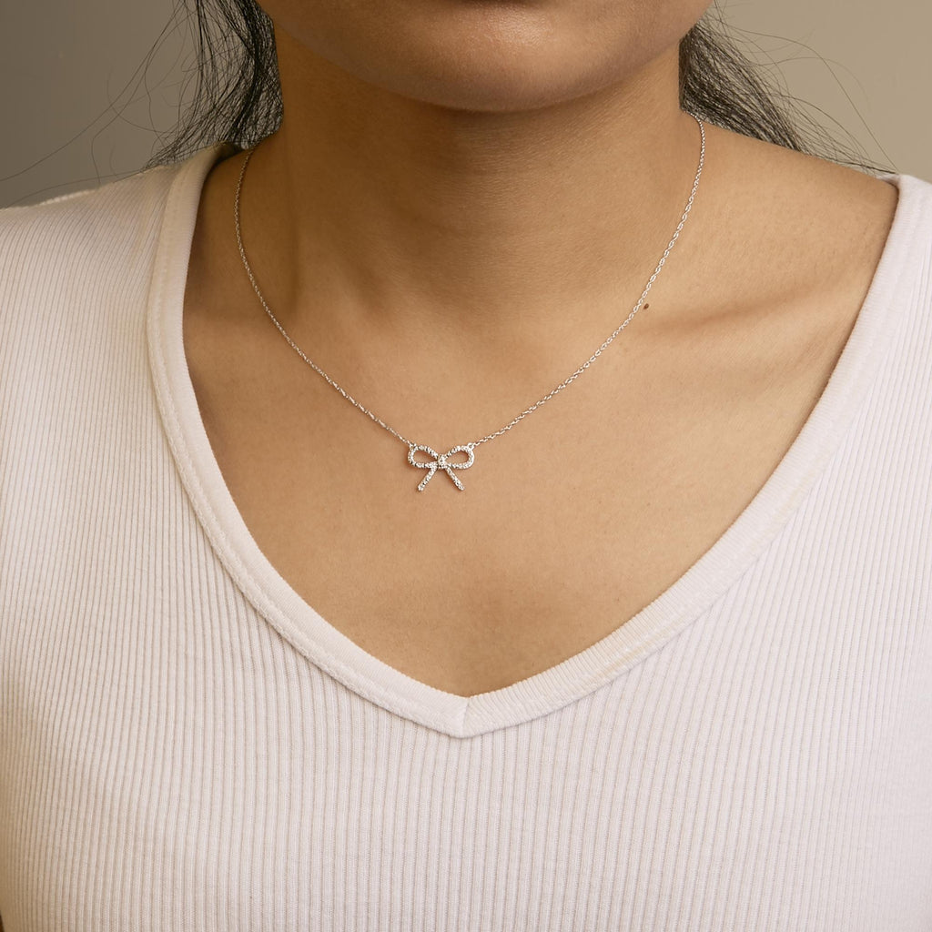 .925 Sterling Silver Diamond Accent Ribbon Bow Knot Pendant Necklace (J-K Color, I2-I3 Clarity) - 18" Inches